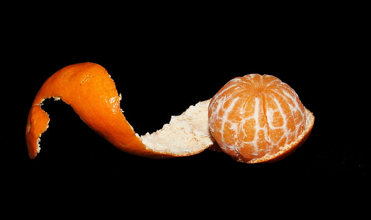 “Peeled clementine fruit (black background)” by PickPik CC0 licensed